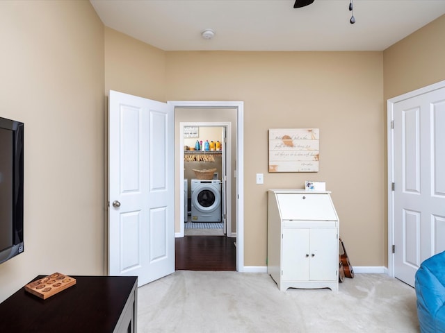 washroom with light colored carpet, baseboards, and ceiling fan