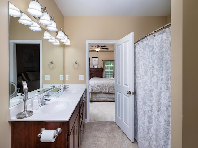full bath with ensuite bathroom, double vanity, and ceiling fan