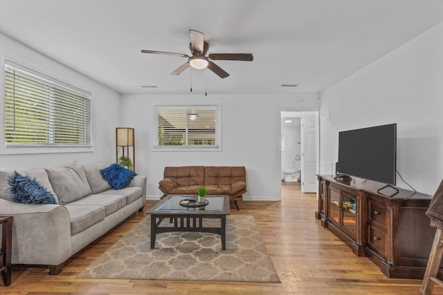 237 Windsor Ct, Spring City, TN 37381 - living area featuring a ceiling fan, light wood-style floors, and plenty of natural light