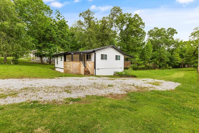 237 Windsor Ct, Spring City, TN 37381 - view of front of house featuring stairway, a front lawn, crawl space, and view of scattered trees