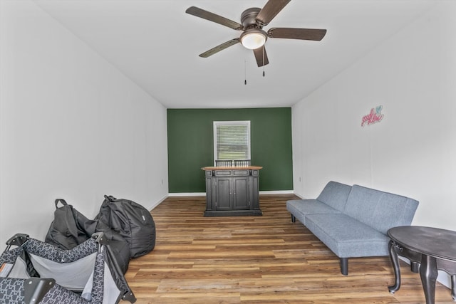 237 Windsor Ct, Spring City, TN 37381 - living area with light wood-style flooring, a ceiling fan, and baseboards