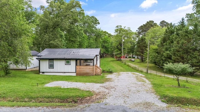237 Windsor Ct, Spring City, TN 37381 - view of front facade featuring board and batten siding, metal roof, and driveway