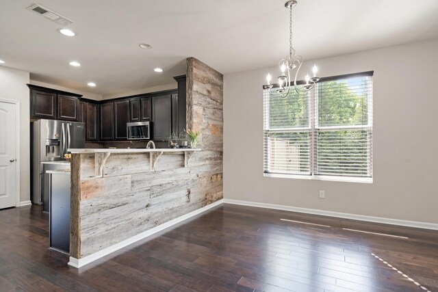 2303 Dewey Dr, Spring Hill, TN 37174 - kitchen featuring stainless steel appliances, a chandelier, baseboards, dark brown cabinets, and dark wood-style floors
