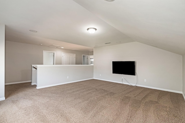 2303 Dewey Dr, Spring Hill, TN 37174 - unfurnished living room featuring carpet floors, vaulted ceiling, and baseboards