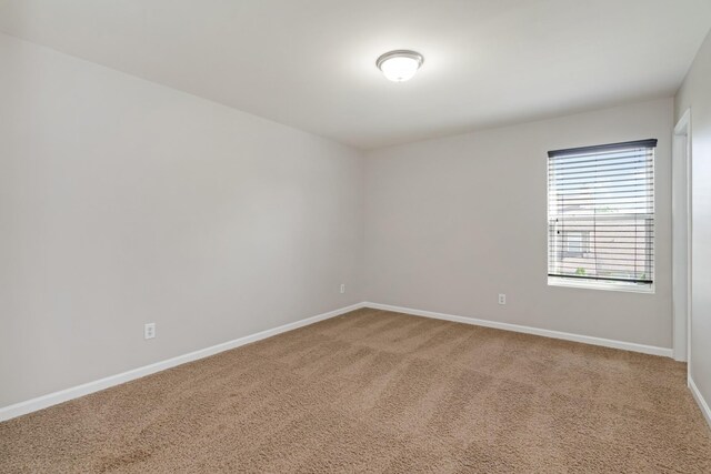 2303 Dewey Dr, Spring Hill, TN 37174 - spare room featuring baseboards and carpet floors