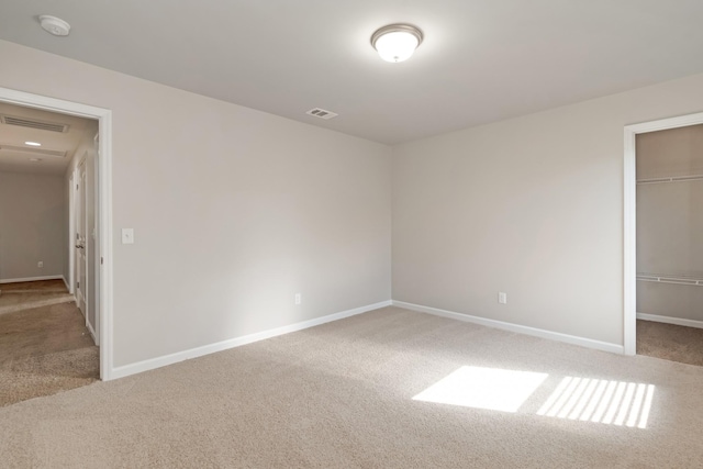 2303 Dewey Dr, Spring Hill, TN 37174 - unfurnished bedroom with carpet floors, a walk in closet, baseboards, and a closet
