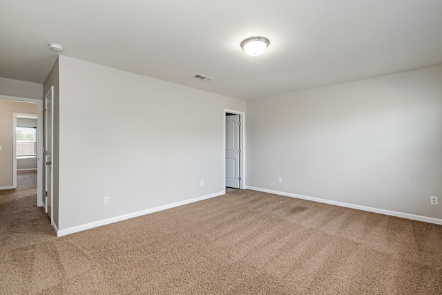 2303 Dewey Dr, Spring Hill, TN 37174 - spare room with carpet, baseboards, and a smoke detector