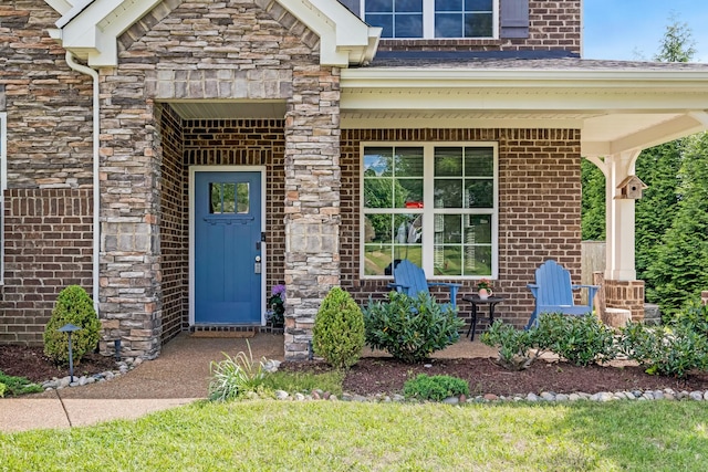 2303 Dewey Dr, Spring Hill, TN 37174 - entrance to property with brick siding, stone siding, and covered porch