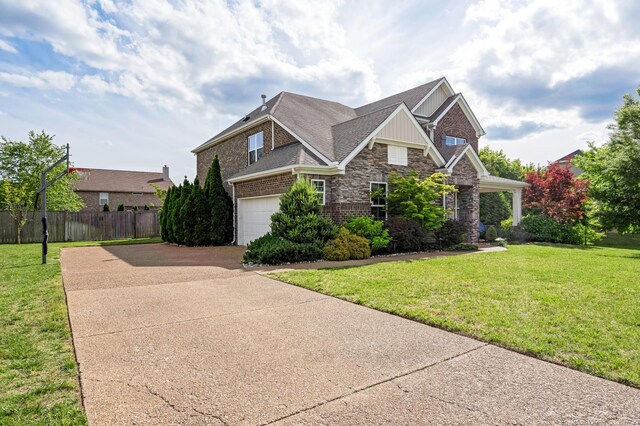 2303 Dewey Dr, Spring Hill, TN 37174 - craftsman-style home featuring driveway, stone siding, brick siding, and a garage