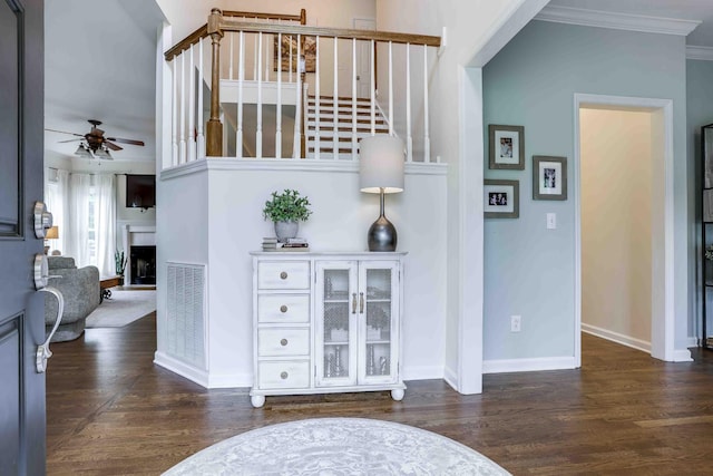 2025 Lewisburg Pike, Franklin, TN 37064 - entrance foyer featuring ceiling fan, stairs, wood finished floors, ornamental molding, and a fireplace