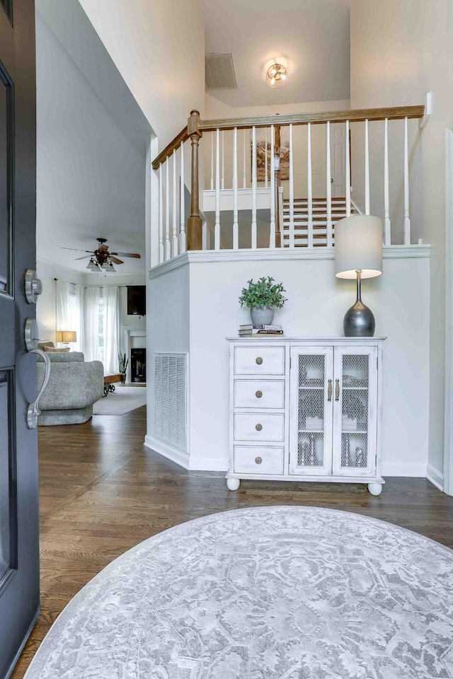 2025 Lewisburg Pike, Franklin, TN 37064 - bar area with dark wood-style flooring, a ceiling fan, baseboards, and a fireplace