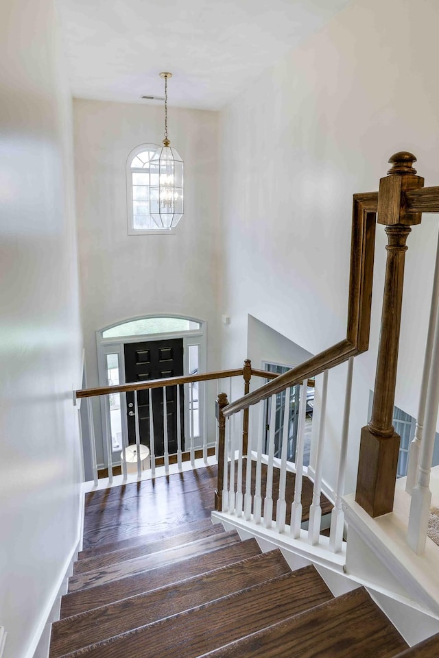 2025 Lewisburg Pike, Franklin, TN 37064 - stairs featuring a chandelier and wood finished floors