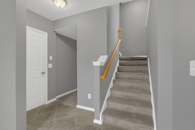 stairway featuring baseboards