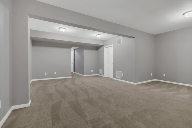finished below grade area featuring carpet floors and baseboards