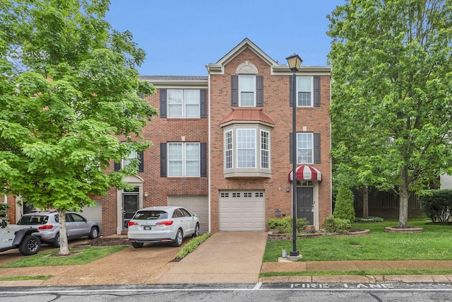 multi unit property featuring driveway, a garage, brick siding, and a front lawn