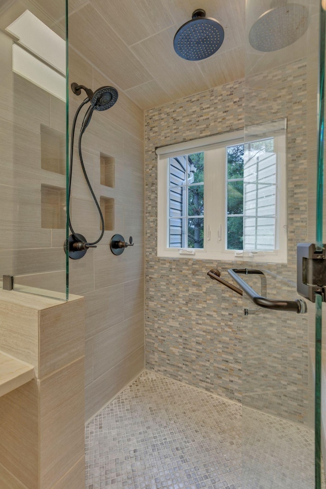bathroom with tiled shower