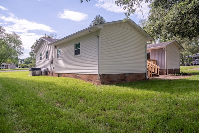 view of property exterior with crawl space and a yard