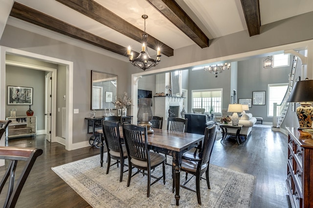dining space featuring a chandelier, baseboards, beamed ceiling, and dark wood-style floors