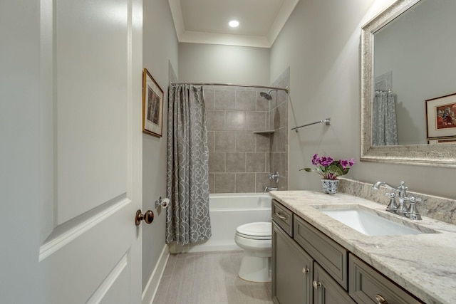 bathroom with toilet, vanity, shower / tub combo with curtain, and ornamental molding