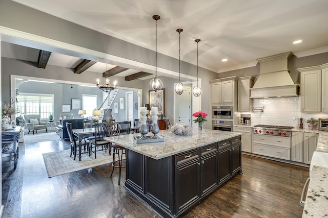 kitchen featuring custom exhaust hood, stainless steel appliances, decorative backsplash, light stone counters, and open floor plan
