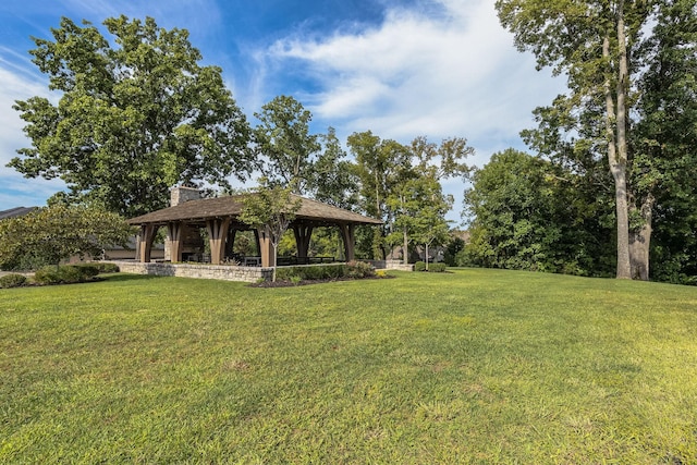 view of property's community featuring a gazebo and a lawn