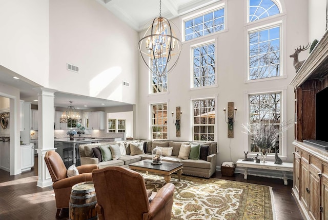 6752 Falls Ridge Ln, College Grove, TN 37046 - living room with a chandelier, a towering ceiling, dark wood finished floors, healthy amount of natural light, and beam ceiling