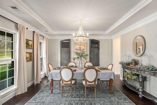 6752 Falls Ridge Ln, College Grove, TN 37046 - dining area with a chandelier, a tray ceiling, dark wood finished floors, ornamental molding, and baseboards