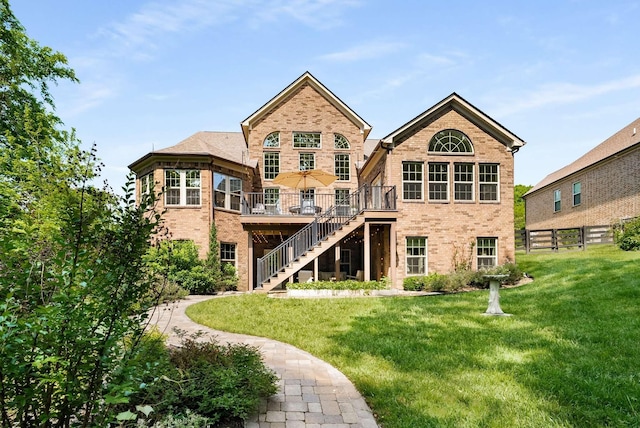 6752 Falls Ridge Ln, College Grove, TN 37046 - rear view of property with stairway, brick siding, and a wooden deck