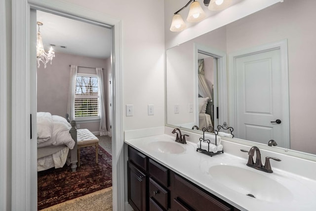 6752 Falls Ridge Ln, College Grove, TN 37046 - ensuite bathroom with double vanity, a chandelier, and baseboards