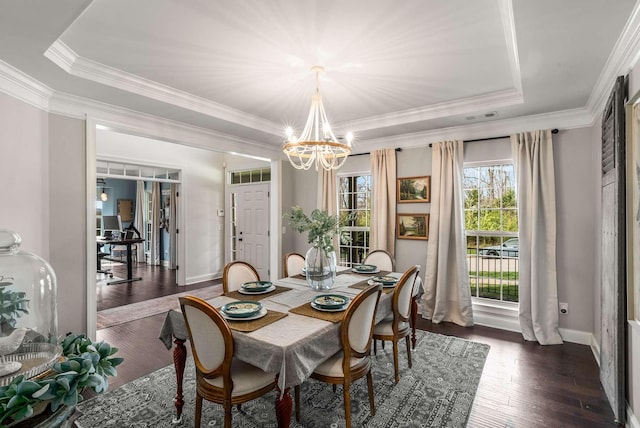 6752 Falls Ridge Ln, College Grove, TN 37046 - dining space with a chandelier, dark wood finished floors, ornamental molding, baseboards, and a raised ceiling