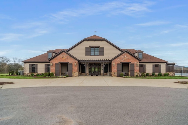 6752 Falls Ridge Ln, College Grove, TN 37046 - view of front of home featuring a pergola, stone siding, and brick siding