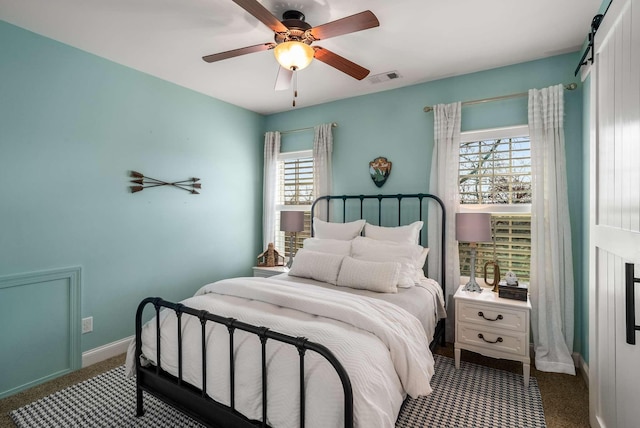 6752 Falls Ridge Ln, College Grove, TN 37046 - carpeted bedroom featuring baseboards and ceiling fan
