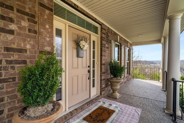 6752 Falls Ridge Ln, College Grove, TN 37046 - doorway to property featuring a porch and brick siding