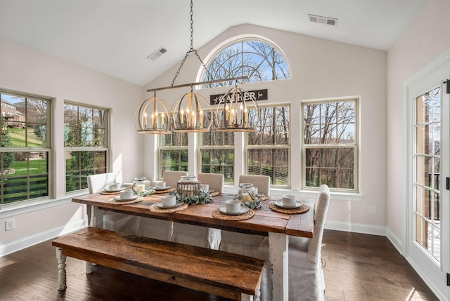6752 Falls Ridge Ln, College Grove, TN 37046 - dining area with a chandelier, vaulted ceiling, dark wood finished floors, and baseboards