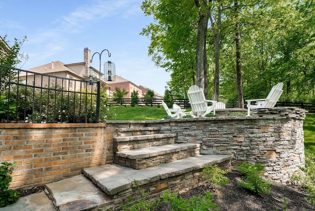 6752 Falls Ridge Ln, College Grove, TN 37046 - view of patio / terrace with fence and a fire pit