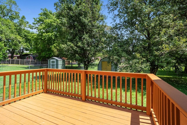 deck featuring a storage unit and an outdoor structure