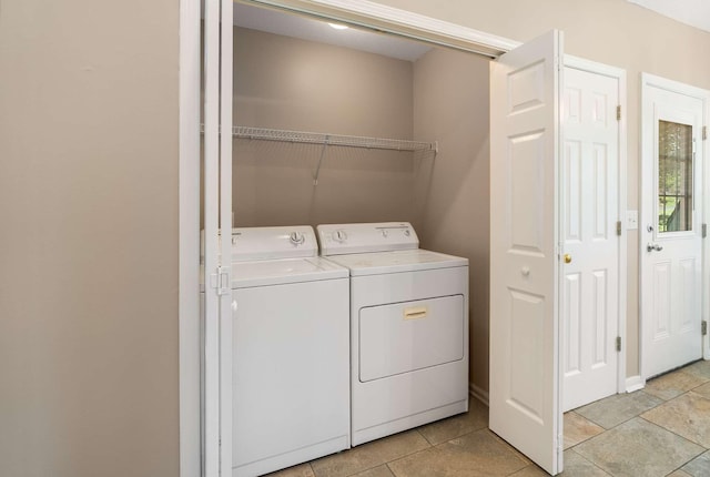 laundry room featuring washing machine and clothes dryer