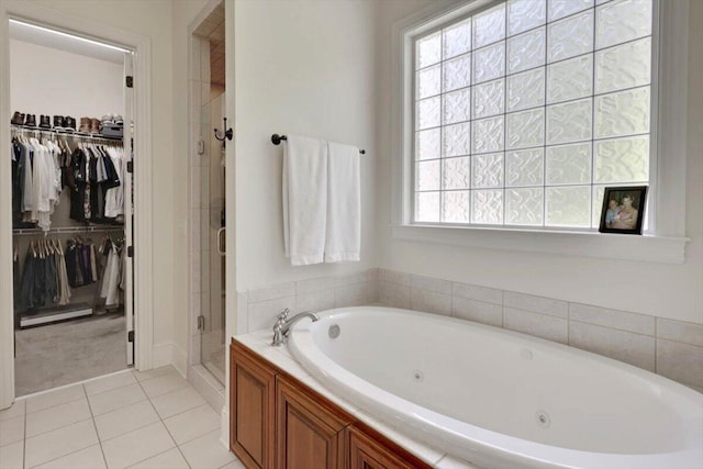 2507 Eagle Creek Way, Signal Mountain, TN 37377 - bathroom featuring a spacious closet, a shower stall, a tub with jets, and tile patterned floors