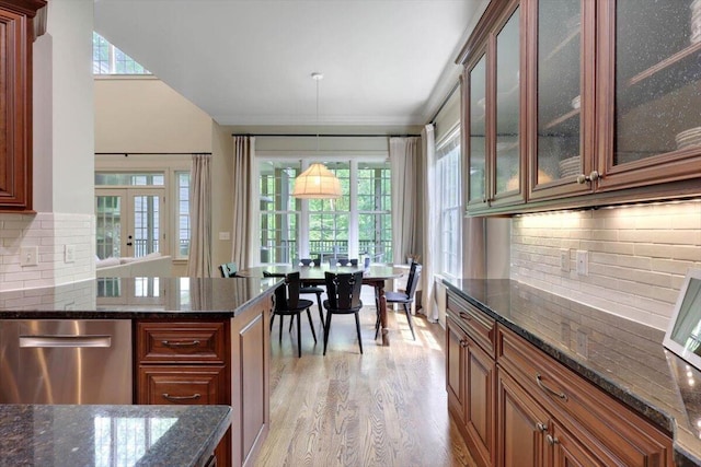 2507 Eagle Creek Way, Signal Mountain, TN 37377 - kitchen with light wood finished floors, dishwasher, decorative backsplash, dark stone counters, and glass insert cabinets