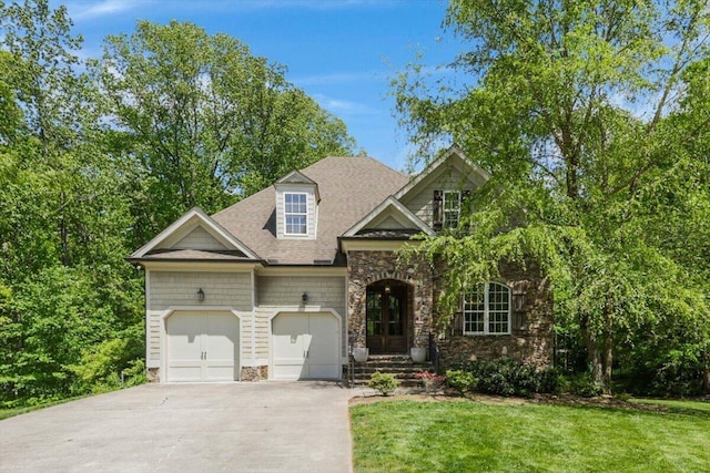 2507 Eagle Creek Way, Signal Mountain, TN 37377 - view of front of property featuring stone siding, concrete driveway, an attached garage, and a front lawn