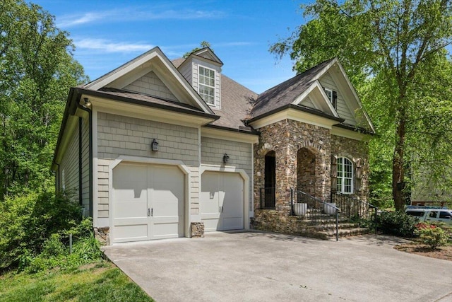 2507 Eagle Creek Way, Signal Mountain, TN 37377 - view of front facade with stone siding, driveway, a garage, and roof with shingles