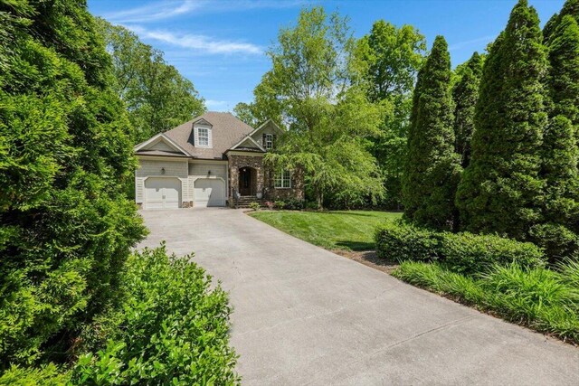2507 Eagle Creek Way, Signal Mountain, TN 37377 - view of front of property featuring driveway, stone siding, a garage, and a front lawn