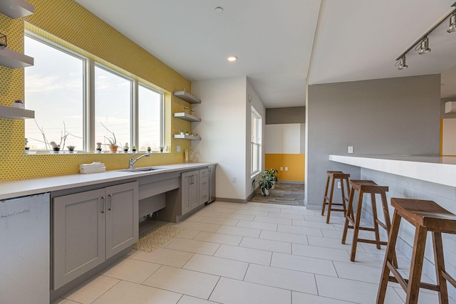400 Herron Dr Unit 107, Nashville, TN 37210 - kitchen featuring open shelves, gray cabinetry, light countertops, a sink, and recessed lighting