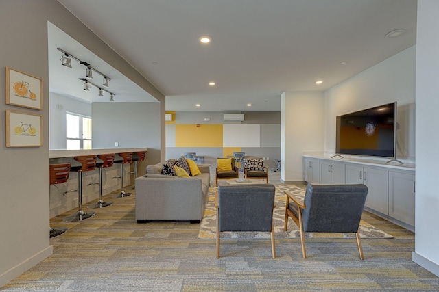 400 Herron Dr Unit 107, Nashville, TN 37210 - living room with light carpet, a wall mounted air conditioner, a dry bar, recessed lighting, and baseboards