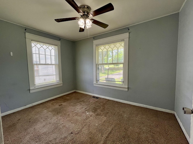 1538 Neelys Bend Rd, Madison, TN 37115 - carpeted empty room with plenty of natural light, a ceiling fan, baseboards, and ornamental molding