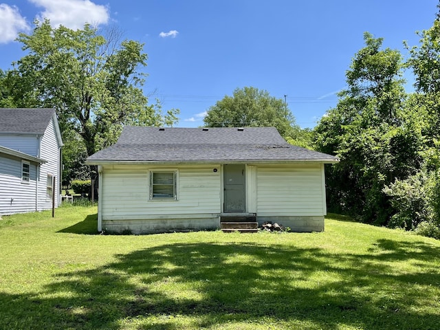 1538 Neelys Bend Rd, Madison, TN 37115 - back of house featuring entry steps, a lawn, and a shingled roof