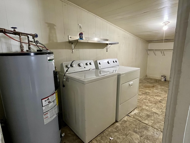 1538 Neelys Bend Rd, Madison, TN 37115 - clothes washing area with water heater, separate washer and dryer, and wooden walls