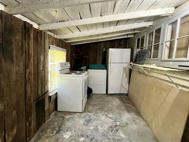 1538 Neelys Bend Rd, Madison, TN 37115 - laundry area featuring independent washer and dryer and wood walls