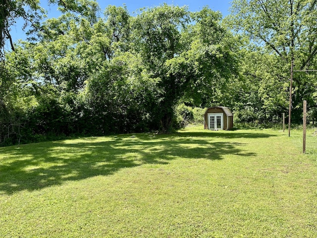 1538 Neelys Bend Rd, Madison, TN 37115 - view of grassy yard featuring an outdoor structure and a storage unit