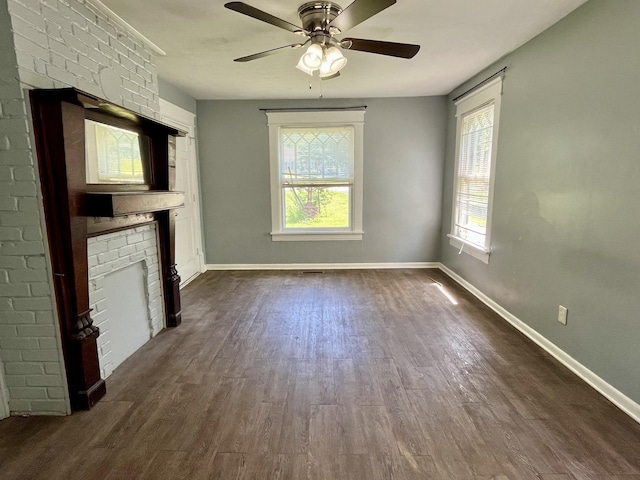 1538 Neelys Bend Rd, Madison, TN 37115 - unfurnished living room with dark wood finished floors, a brick fireplace, baseboards, and a ceiling fan